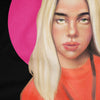 An extreme close-up of a graphic fabric print showing the detailed features of a blonde woman's face from a portrait illustration, with a vibrant pink circular accent behind her and an orange top, all set against a black background.