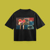 A flat-lay product photograph of a black t-shirt centered on a solid olive-green background. The t-shirt features a graphic print of the artist deadmau5 with a stylized character, a boombox, and textured, collage-style background elements.