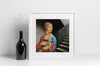 Lifestyle product photograph of the limited edition archival art print 'LADY WITH AN ERMINE' LWAE by Nemozine, displayed in a white frame next to a dark glass bottle vase holding delicate white sprigs on a clean, white surface.