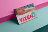 Product photograph of an art cover  sketchbook featuring a provocative still from BLUE IS THE WARMEST COLOUR artwork by Nemozine, displayed against a vibrant pink and teal geometric background.